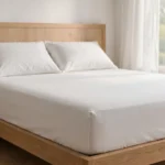 fitted sheet corners held tight to stop fitted sheet slipping off mattress