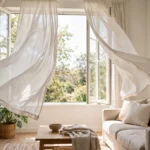 curtains billowing inward from an open window showing how to stop curtains from blowing inward with windows open